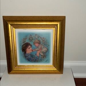 ART TILE  BY ARTIST EDNA HIBEL
Framed Mother and Child. Title:”DAYDREAMS”